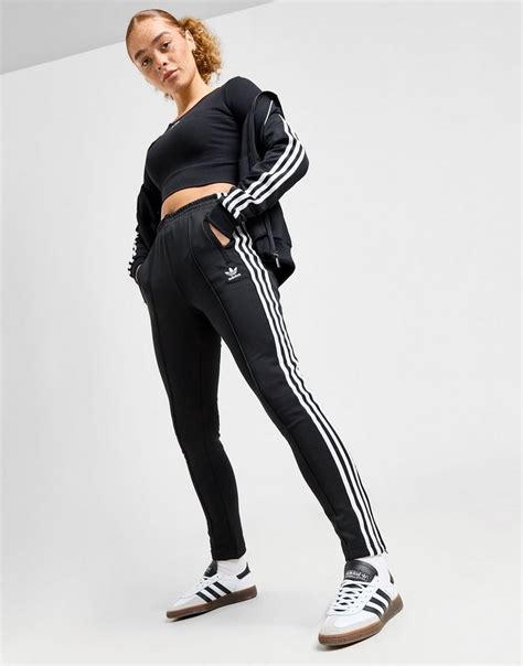 adidas broek zwart zitstrepen|Zwart adidas Originals SST Track Broek .